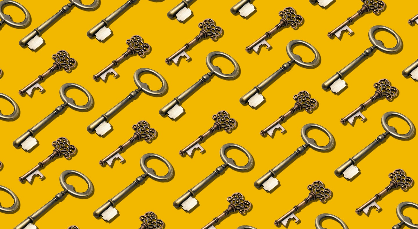 An image of keys on a yellow background, symbolizing workload access control